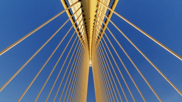 Looking up to the top of a suspension bridge